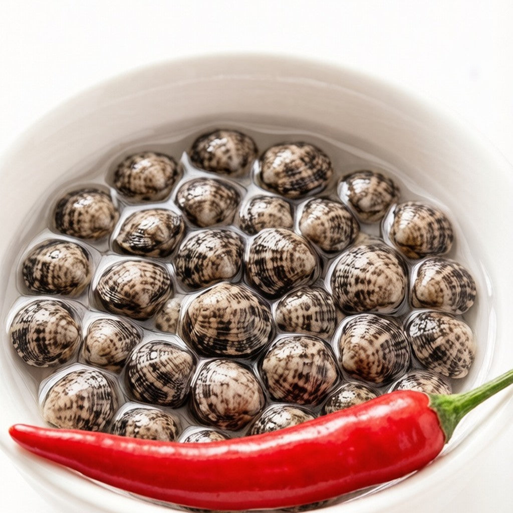 Live clams with a red chilli