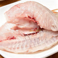 Raw bream fillet on a plate